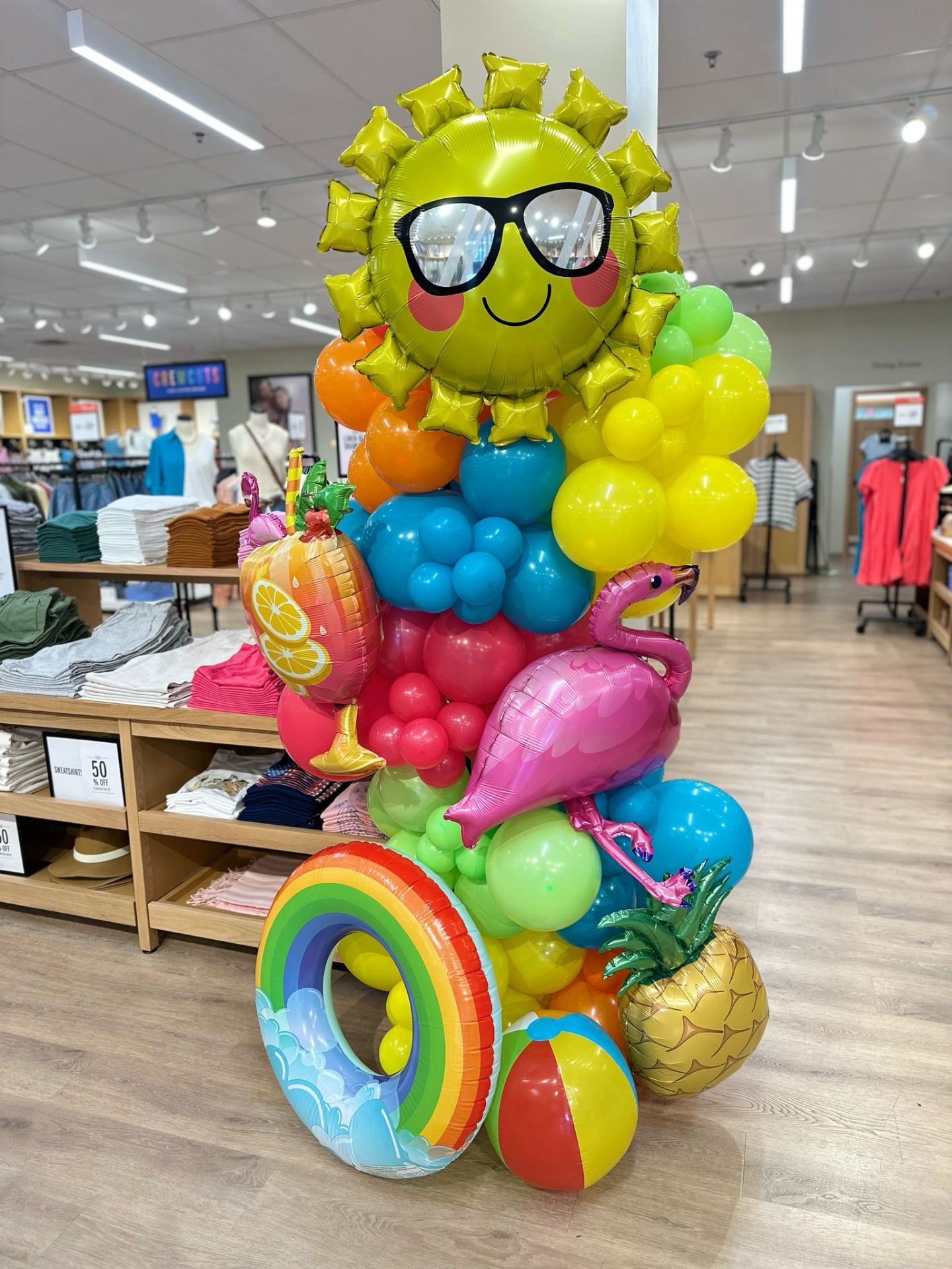 Tropical summer balloon centerpiece with sun, flamingo and pineapple